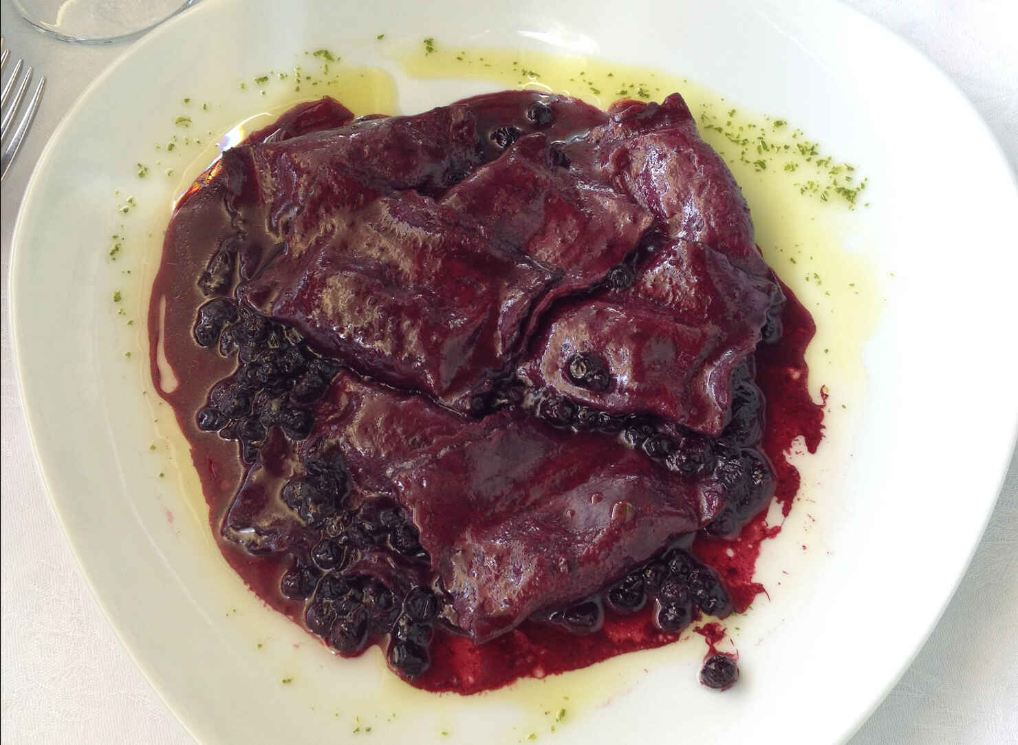 cervo ravioli in wild berry sauce